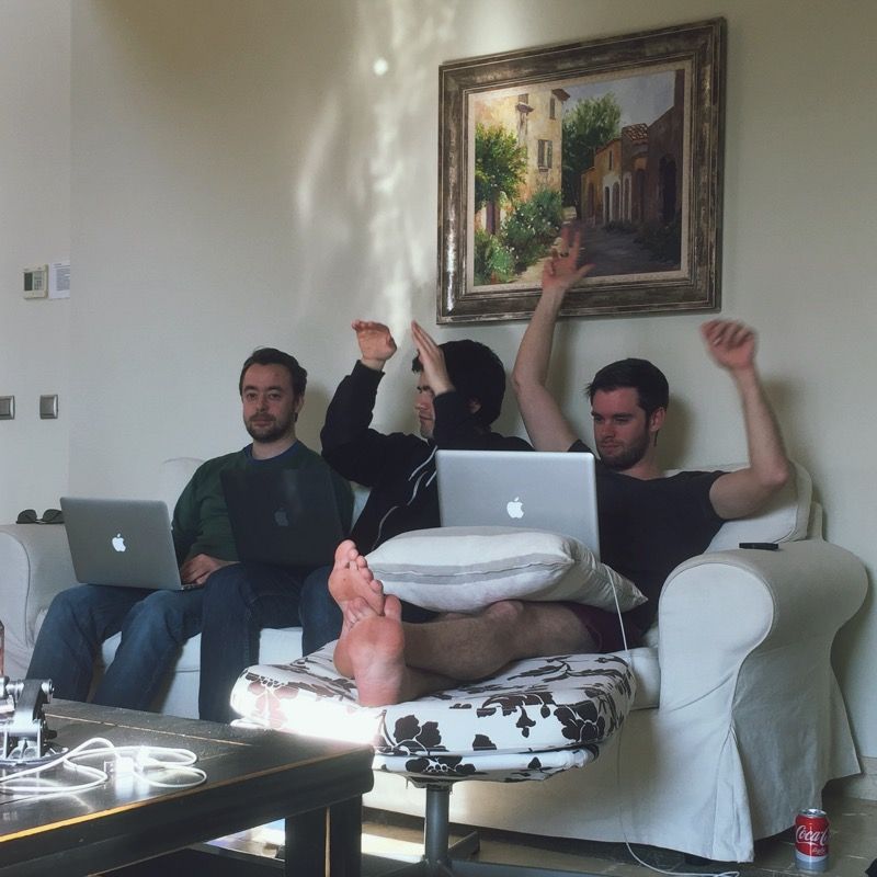 3 developers on a sofa