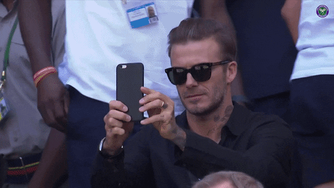 David Beckham using phone