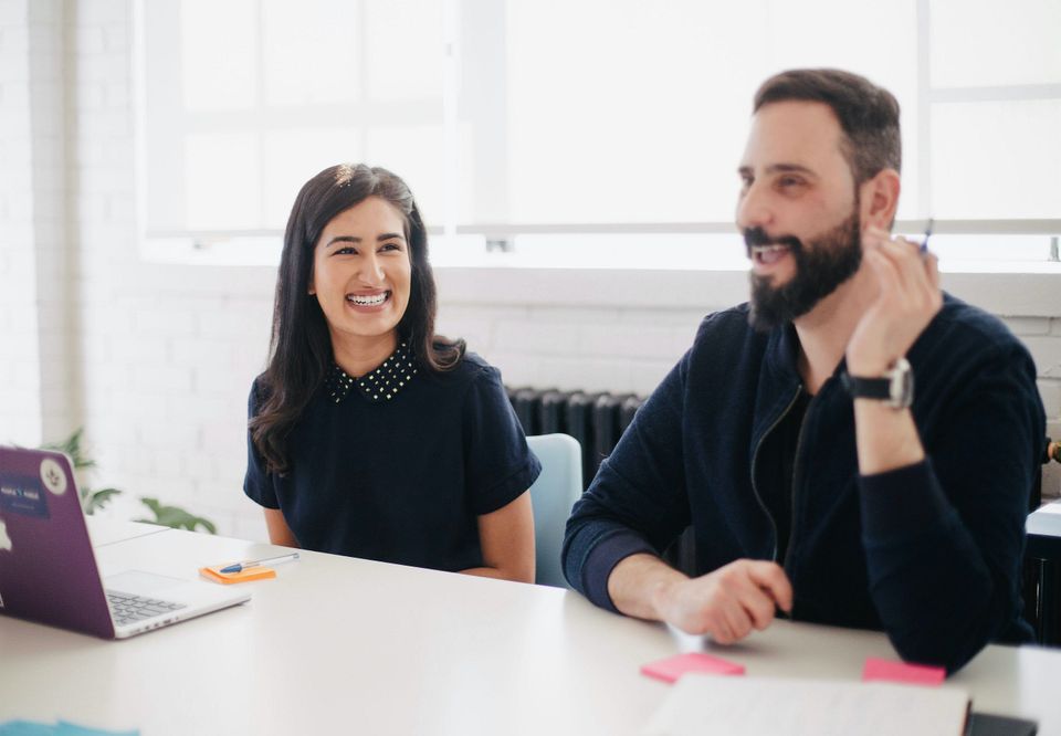 Tech colleagues smiling