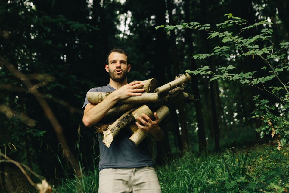 George carrying wood
