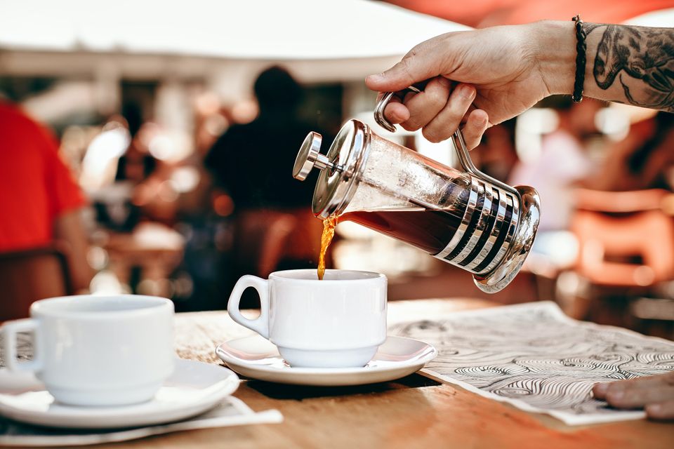 Coffee being poured into a cup