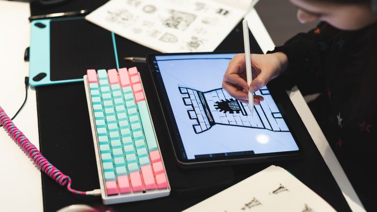 Laura illustrating on an iPad Pro