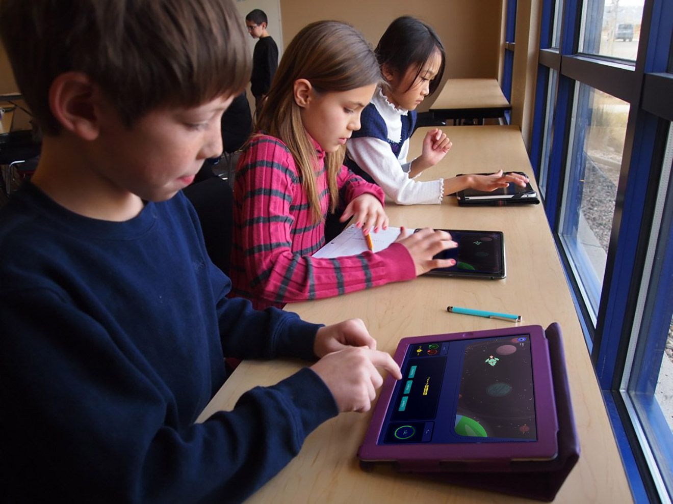 Children playing Educational game on iPads