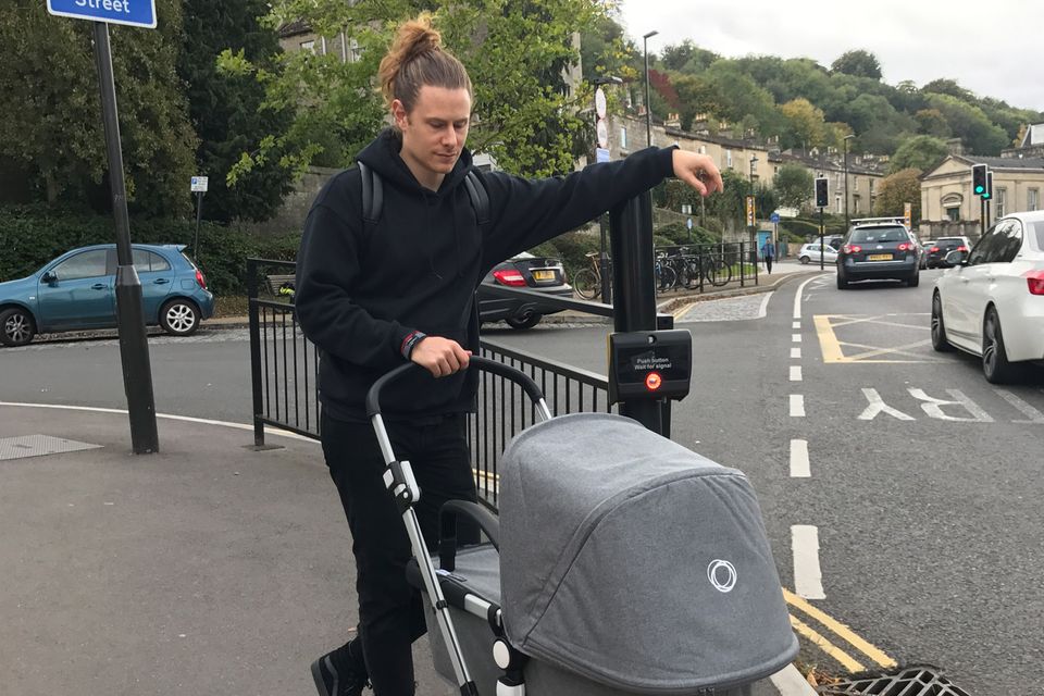 Hugo pushing a pram