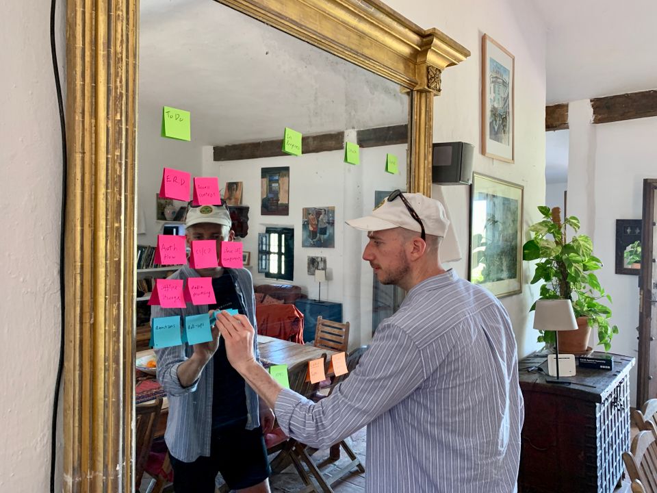Matt adding Post-it notes to mirror